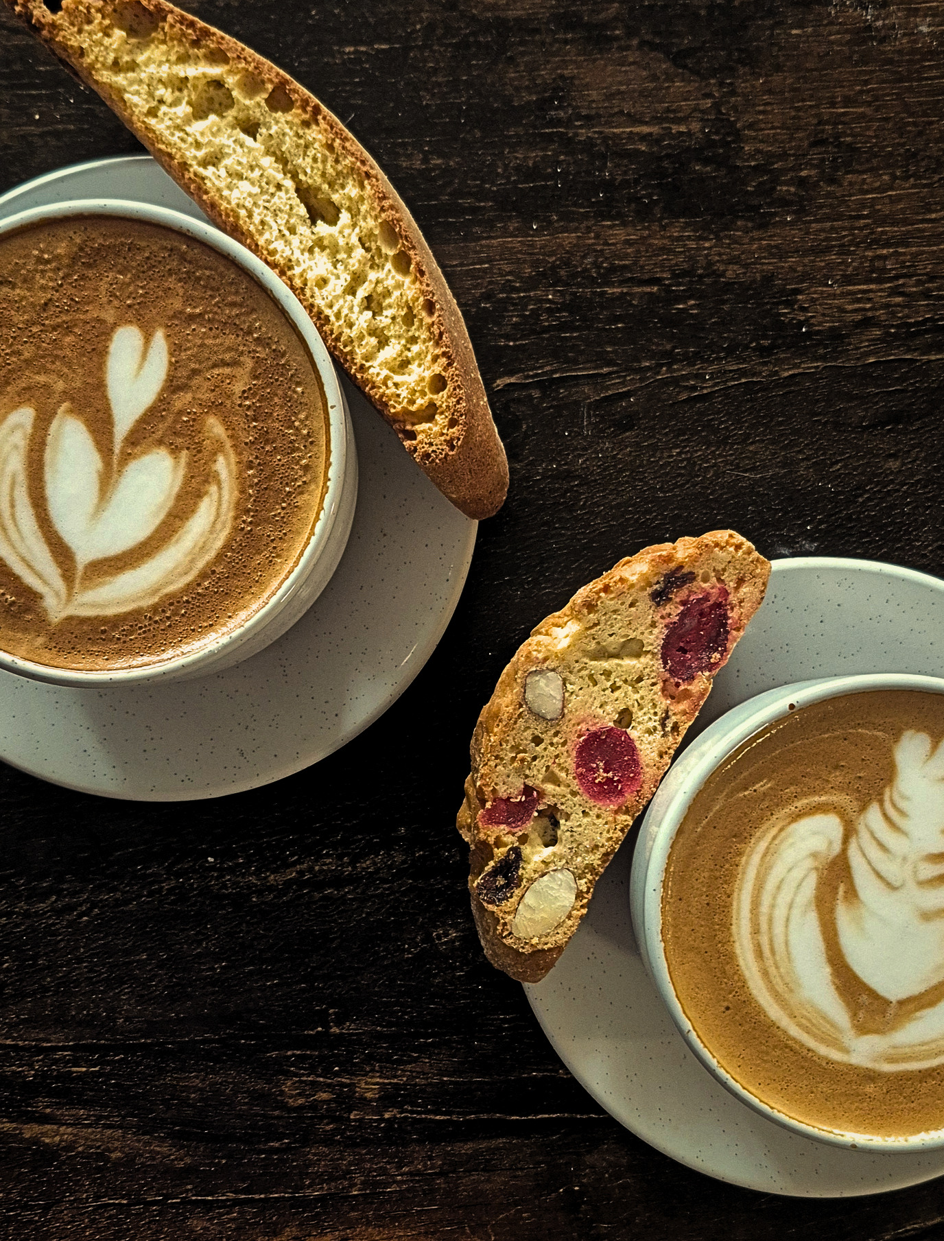 Two Cappuccinos and Biscotti cookies on clean and pretty saucers with latte art for indoor corporate events in south Jersey